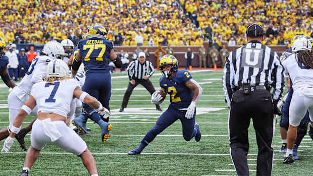 Michigan’s Blake Corum rushes the ball vs. Penn State.
